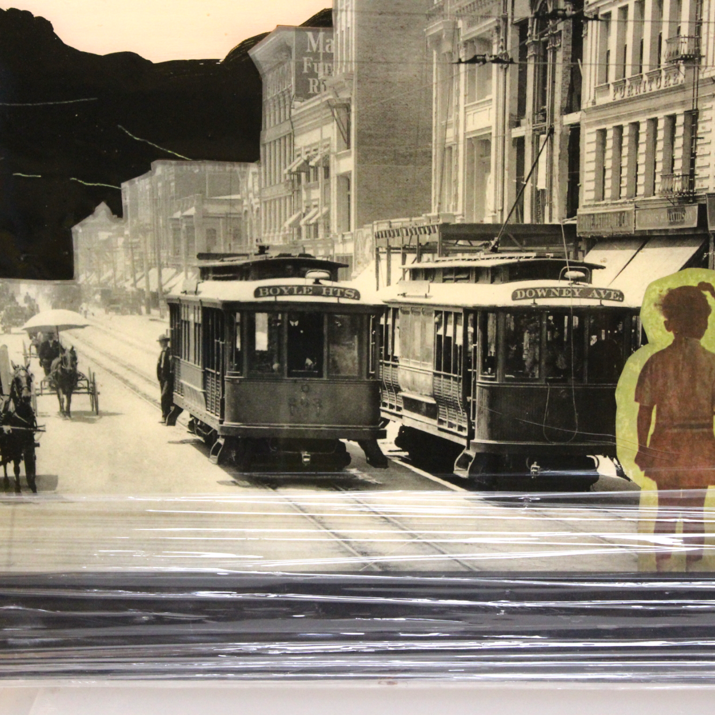 A framed “puzzle/collage” of downtown Los Angeles (“DTLA”) covered in resin