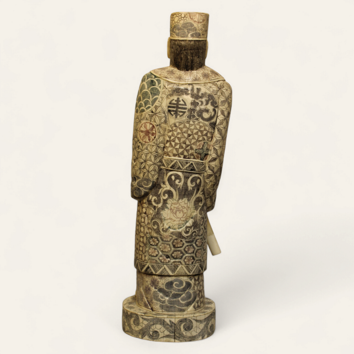 Standing Elder Chinese man with sword bone relief statue