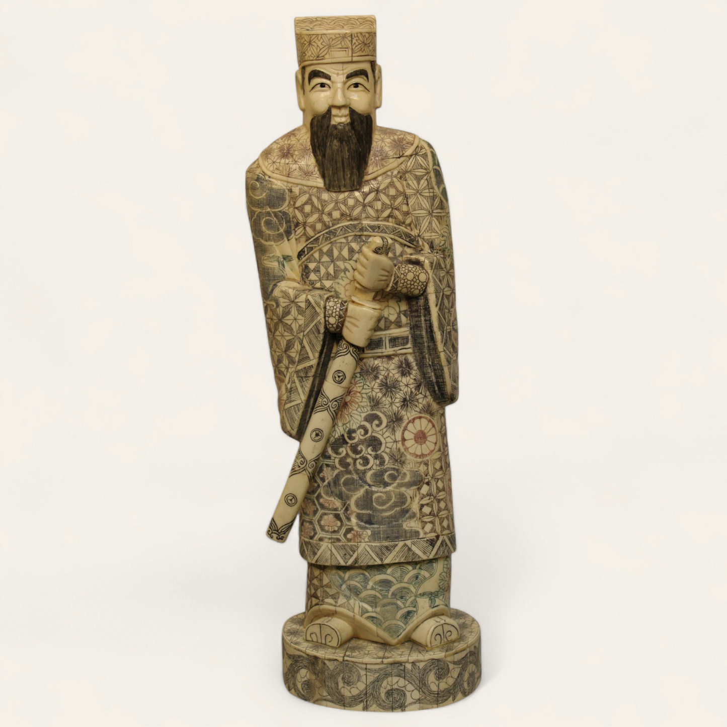 Standing Elder Chinese man with sword bone relief statue