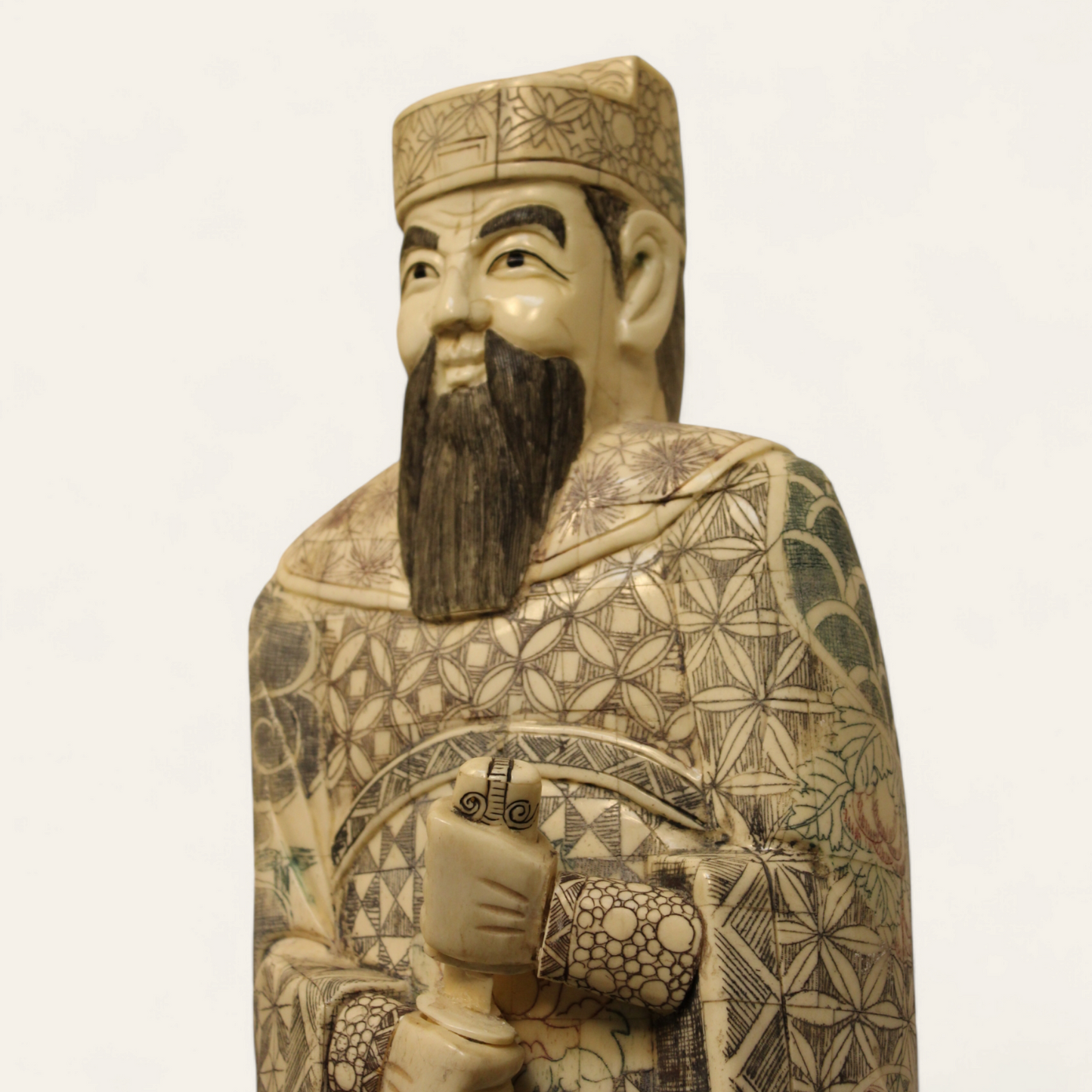 Standing Elder Chinese man with sword bone relief statue